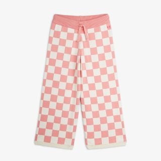 Pink and white chess check knitted trousers with a drawstring waist and ribbed trims.
