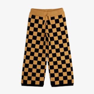 Brown and black Chess check knitted trousers featuring a drawstring waist and embroidered logo.