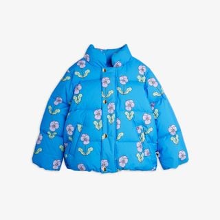 Blue puffer jacket featuring an all-over floral print and gold snap buttons.
