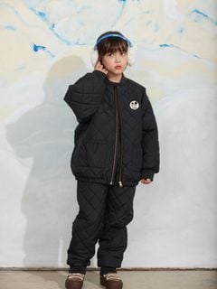 Black quilted outerwear jacket and matching trousers featuring a Ritzratz patch.