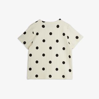 Off-white short-sleeved top featuring a black Dots print, shown from the back.