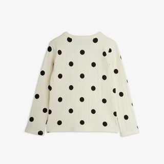 Off-white long-sleeved top with a black Dots print, featuring a ribbed texture and shown from the back.