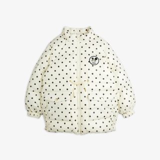 Off-white polka dot heavy puffer jacket featuring a Ritzratz patch on the chest, front pockets, and zip closure.