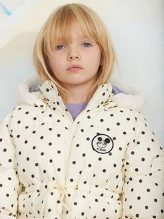 Off-white polka dot heavy puffer jacket with a Ritzratz patch and a faux fur hood.