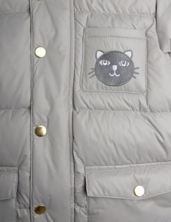 Close-up of a grey puffer jacket featuring gold-toned snap buttons and a cat face patch on the chest pocket.