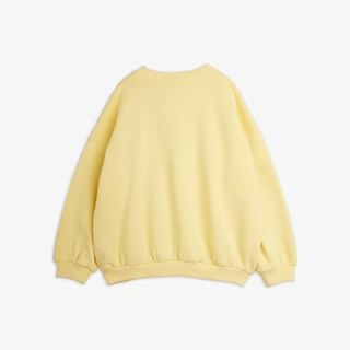 Yellow sweatshirt featuring dropped shoulders and ribbed trims, seen from the back.