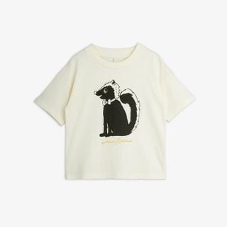 Off-white short-sleeve top featuring a black and white Skunk print with a bow tie on the chest.