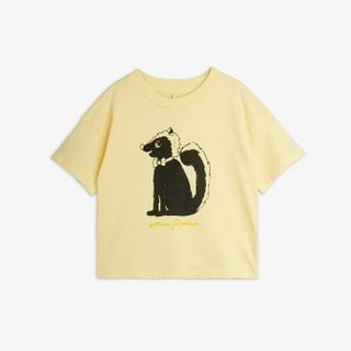Yellow short-sleeved top featuring a Skunk print with a bow tie and script logo.