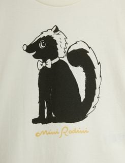 Close-up of a black and white Skunk print wearing a bow tie on an off-white background with a yellow brand logo.