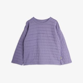 Purple long-sleeved top featuring horizontal rows of textured frills and a rounded neckline.