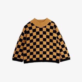 Brown and black chess check knitted sweater with ribbed trims and a high collar.