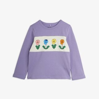 Purple long-sleeved top featuring a white chest panel with a colorful Violas flower print.