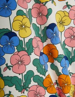 Close-up of the multi-colored Violas print featuring blue, pink, yellow, and orange flowers with green leaves.