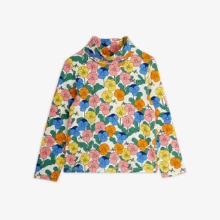 Long-sleeved turtleneck featuring an all-over colorful Violas flower print in yellow, blue, orange, and pink.