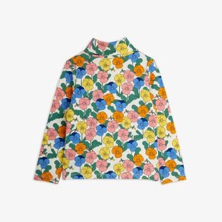 Turtleneck featuring a colorful Violas flower print in pink, yellow, blue, and orange, shown from the back.