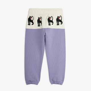 Purple sweatpants featuring a cream waistband panel with black Panther prints, shown from the back.