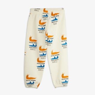 Off-white sweatpants featuring an all-over Velvet worms print, shown from the back.