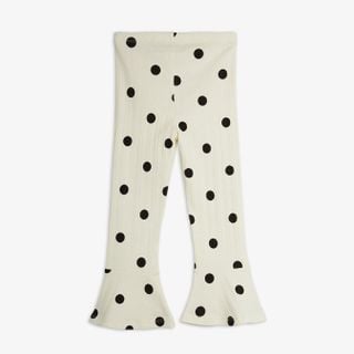 Off-white flared trousers with a black dots pattern, shown from the back.