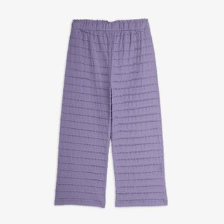 Purple textured frill trousers featuring an elastic waistband, shown from the back.