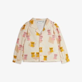 Cream blouse featuring a yellow and pink Kittens print, camp collar, and gathered puff sleeves.