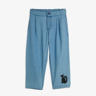 Blue lightweight denim trousers featuring front pleats, an elastic waistband, and a Skunk motif on the leg.