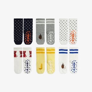 Multi-colored six-pack of anti-slip socks featuring kitten motifs, dots, stripes, and ribbed cuffs.