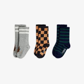 Chess check, striped, and animal motif organic cotton socks in a 3-pack with ribbed cuffs and logo soles.