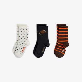 Organic cotton 3-pack socks featuring Elephant shrew motifs, black dots, and brown and orange stripes with ribbed cuffs.