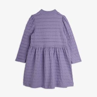 Purple long-sleeved dress featuring all-over scalloped textured frills and a gathered waist, shown from the back.