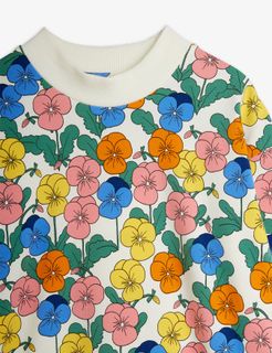 Close-up of the white dress featuring the colorful Violas floral print and a ribbed collar.
