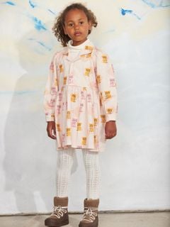 Pale pink long-sleeve dress with a Kittens print, pointed collar, and front buttons.