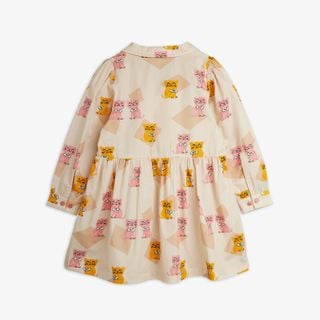Long-sleeve woven dress featuring an all-over Kittens print in yellow and pink, shown from the back.
