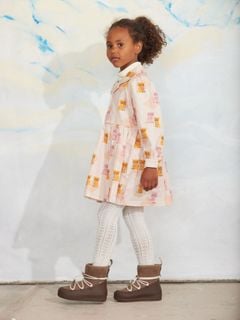 Light pink woven dress featuring a Kittens pattern, long sleeves, and a pointed collar.