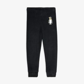 Black microfleece trousers with an elastic waist and a penguin patch on the upper leg.