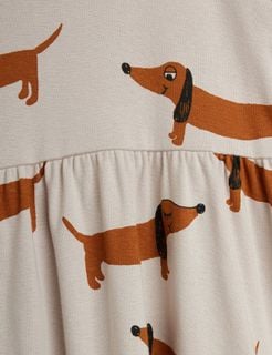 Grey dress detail featuring a brown dachshund dog print and a gathered waist seam.