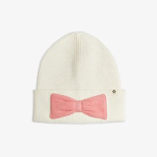 Off-white knitted beanie with a folded hem, pink bow, and small panda logo tab.