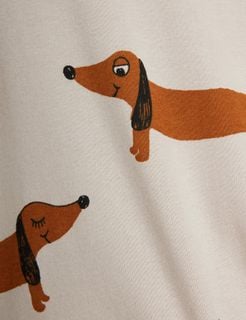 Brown Dog print featuring dachshunds on a light grey top, shown in a close-up.