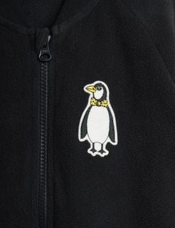 Black microfleece jacket featuring a zipper and a penguin patch with a yellow bow tie.