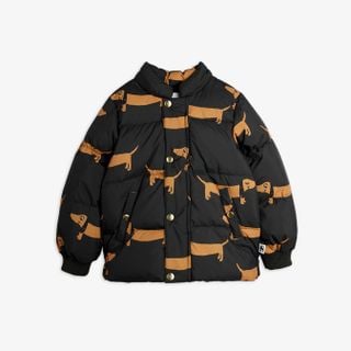 Black padded jacket with a brown Dog print, featuring gold snap buttons and front pockets.