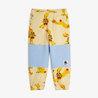 Yellow fleece trousers with a Rabbits print, light blue contrast knee panels and elasticated cuffs.