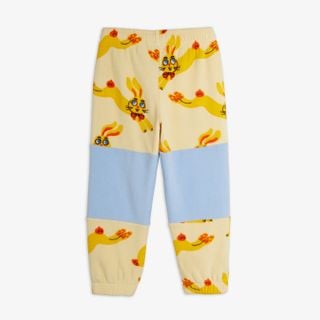 Yellow fleece trousers featuring a Rabbits print, light blue contrast knee panels and elastic cuffs.