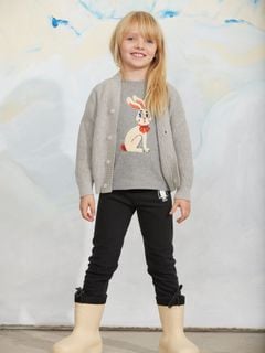 Grey melange long-sleeve top with a rabbit application, worn by a child with a grey cardigan and black trousers.