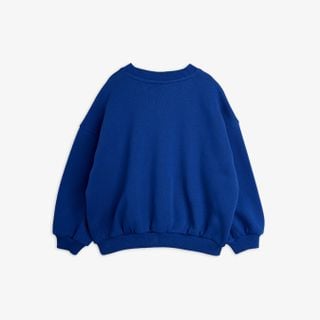 Blue sweatshirt shown from the back featuring dropped shoulders and ribbed trims.
