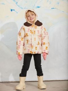 Padded puffer jacket featuring a Kittens print and brown faux fur collar, worn by a child.