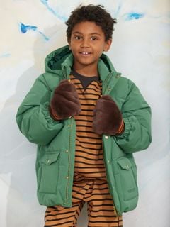 Solid forest-green heavy puffer jacket with a hood, worn by a child wearing brown furry mittens and a striped top.