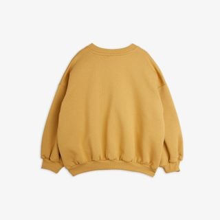 Beige sweatshirt seen from the back featuring a crew neck and ribbed trims.