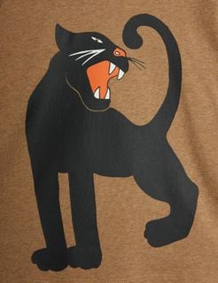 Close-up of the black roaring Panther print with orange details on a brown melange top.