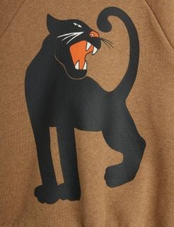 Black Panther print with white teeth and an orange mouth on a brown melange sweatshirt.