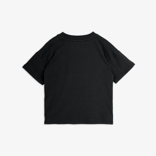 Black short-sleeved t-shirt shown from the back, featuring dropped shoulders and a ribbed neckline.