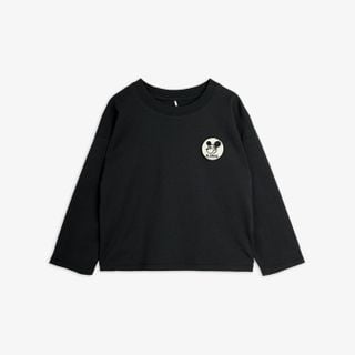 Black long-sleeved top featuring a white Ritzratz patch on the chest.